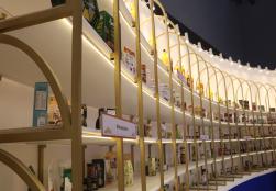 More than 500 Processed Food Products by PMFME Scheme Beneficiaries Showcased at the MoFPI Pavilion Product Display Wall.