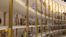 More than 500 Processed Food Products by PMFME Scheme Beneficiaries Showcased at the MoFPI Pavilion Product Display Wall.